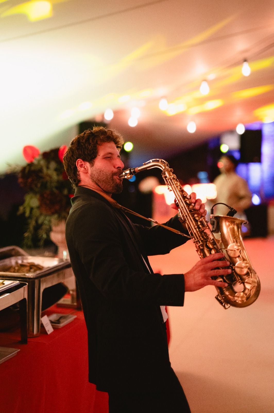 Saxophone musician performing at an elegant corporate event